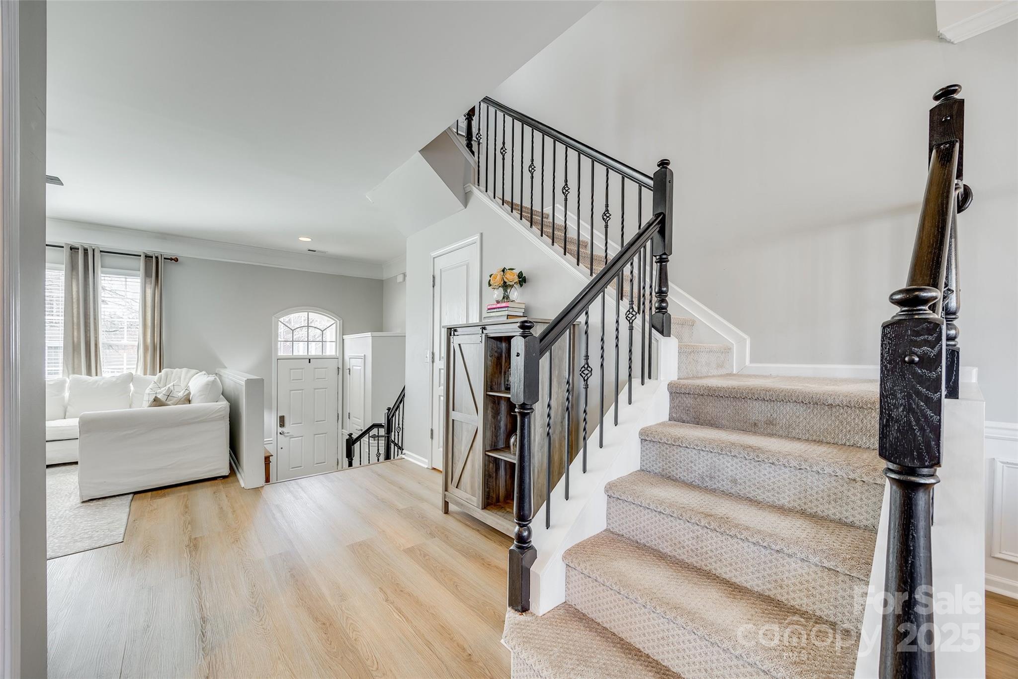 663 6th Baxter Crossing Fort Mill, SC 29708 - Photo 15 of 38 a view of staircase with white walls and railing