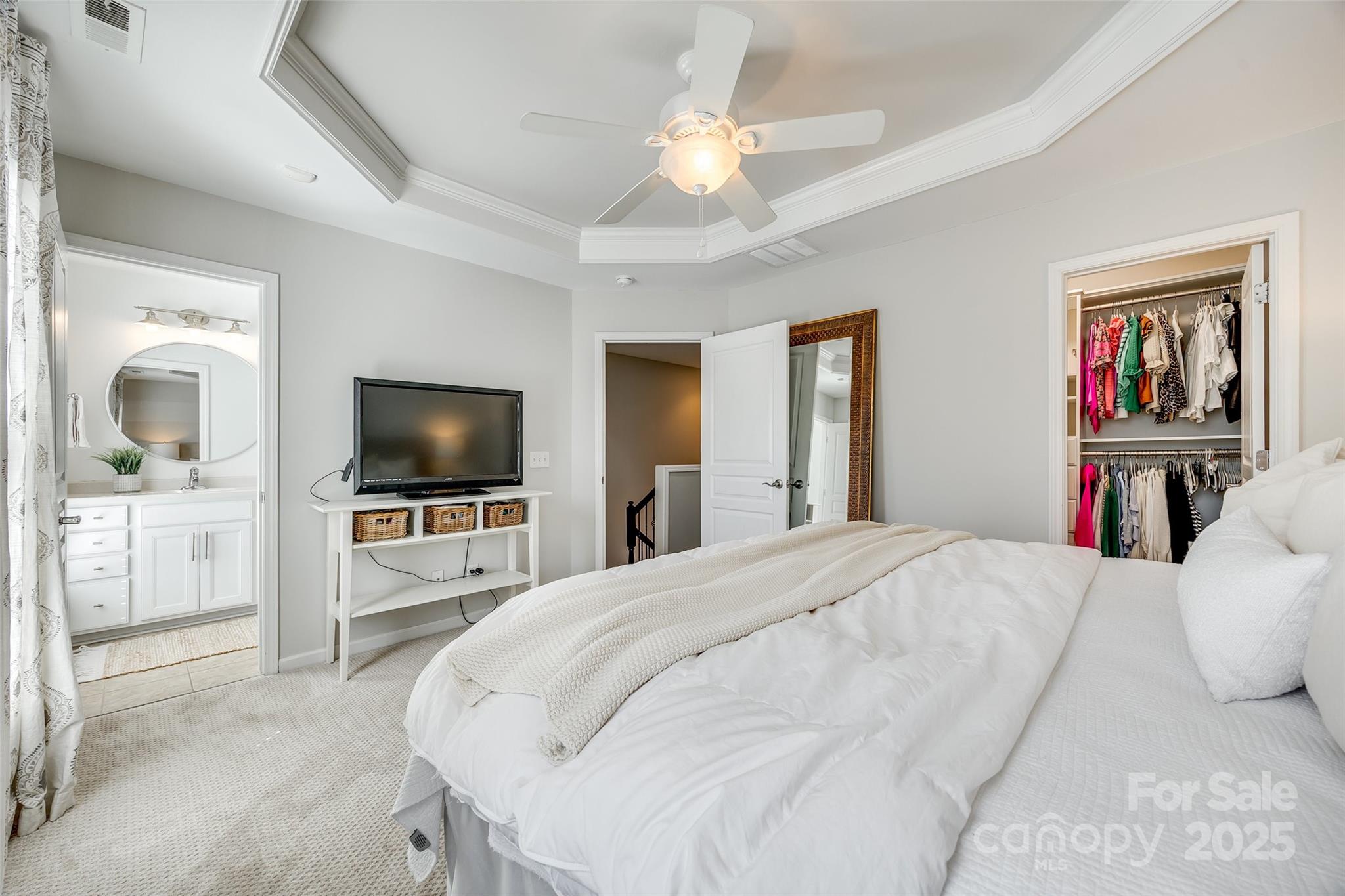 663 6th Baxter Crossing Fort Mill, SC 29708 - Photo 18 of 38 a bedroom with a bed and a flat screen tv