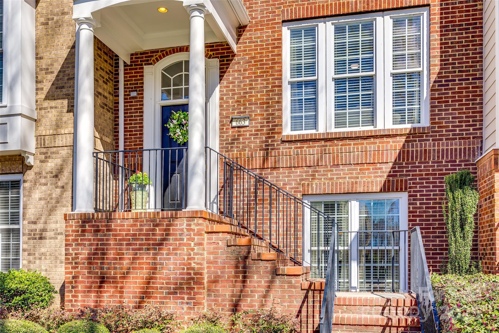 663 6th Baxter Crossing Fort Mill, SC 29708 - Photo 2 of 38 a view of a brick building with many windows