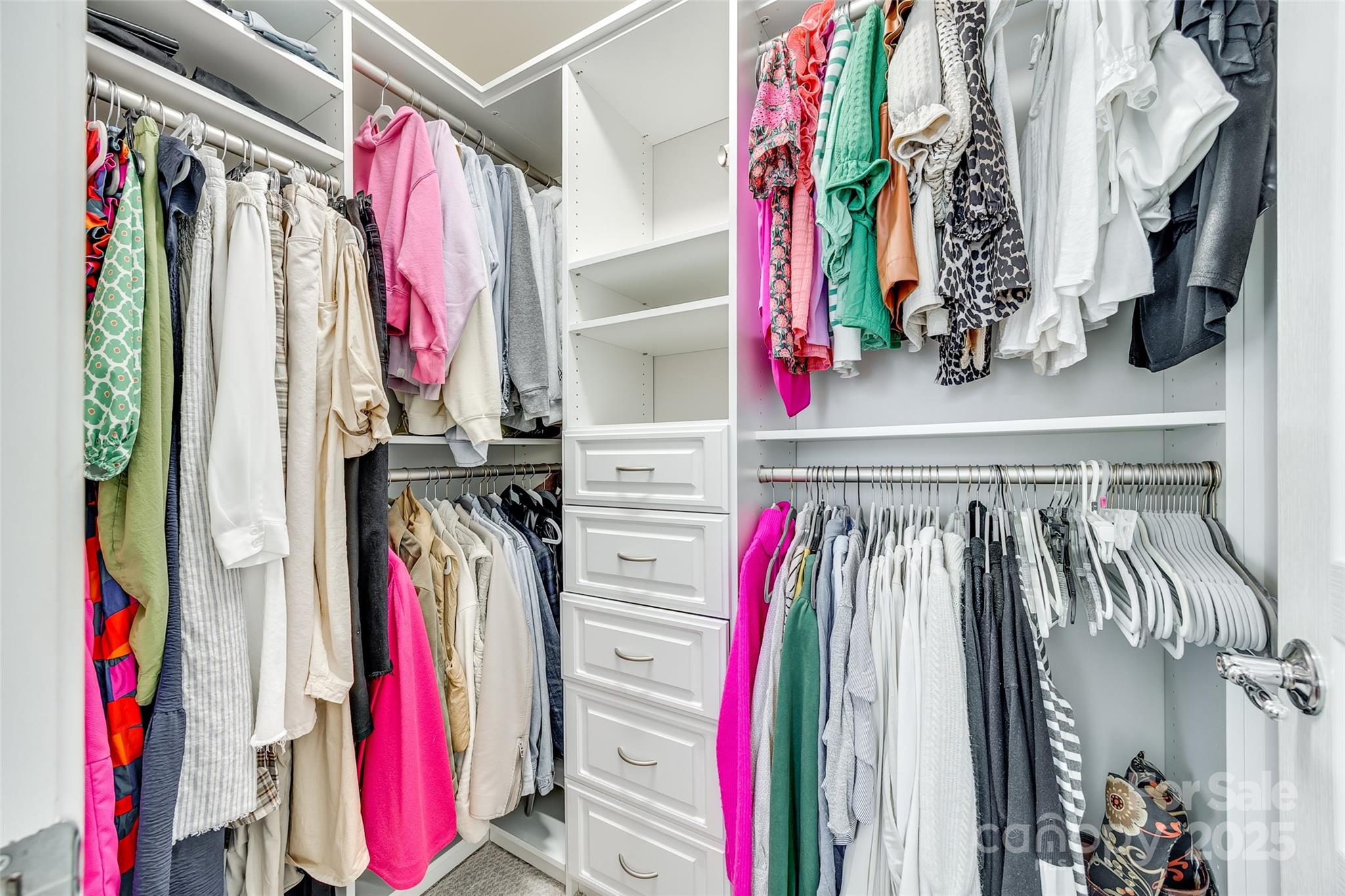 663 6th Baxter Crossing Fort Mill, SC 29708 - Photo 21 of 38 a view of walk in closet with clothes