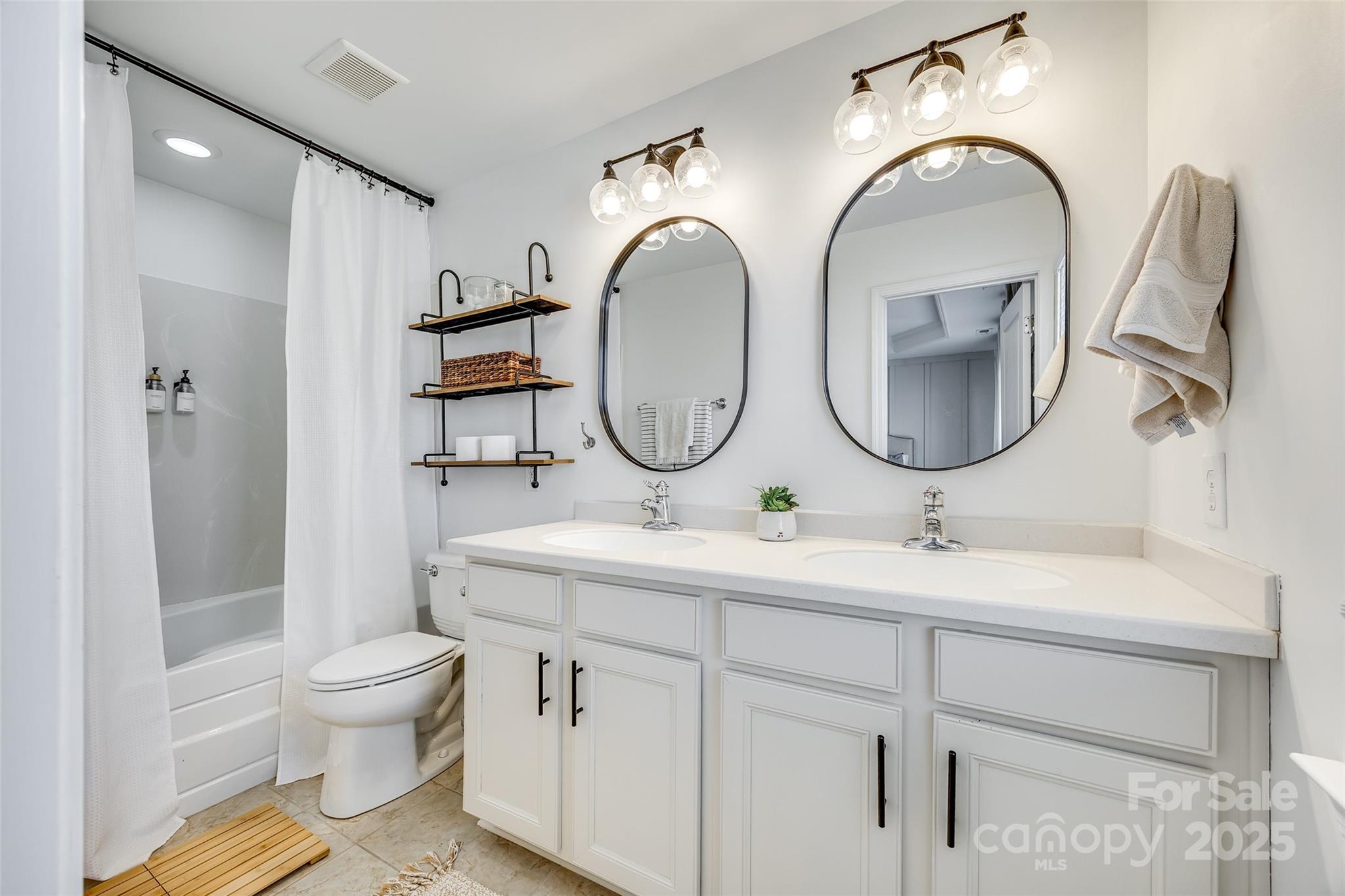 663 6th Baxter Crossing Fort Mill, SC 29708 - Photo 25 of 38 a bathroom with a toilet a sink and a mirror