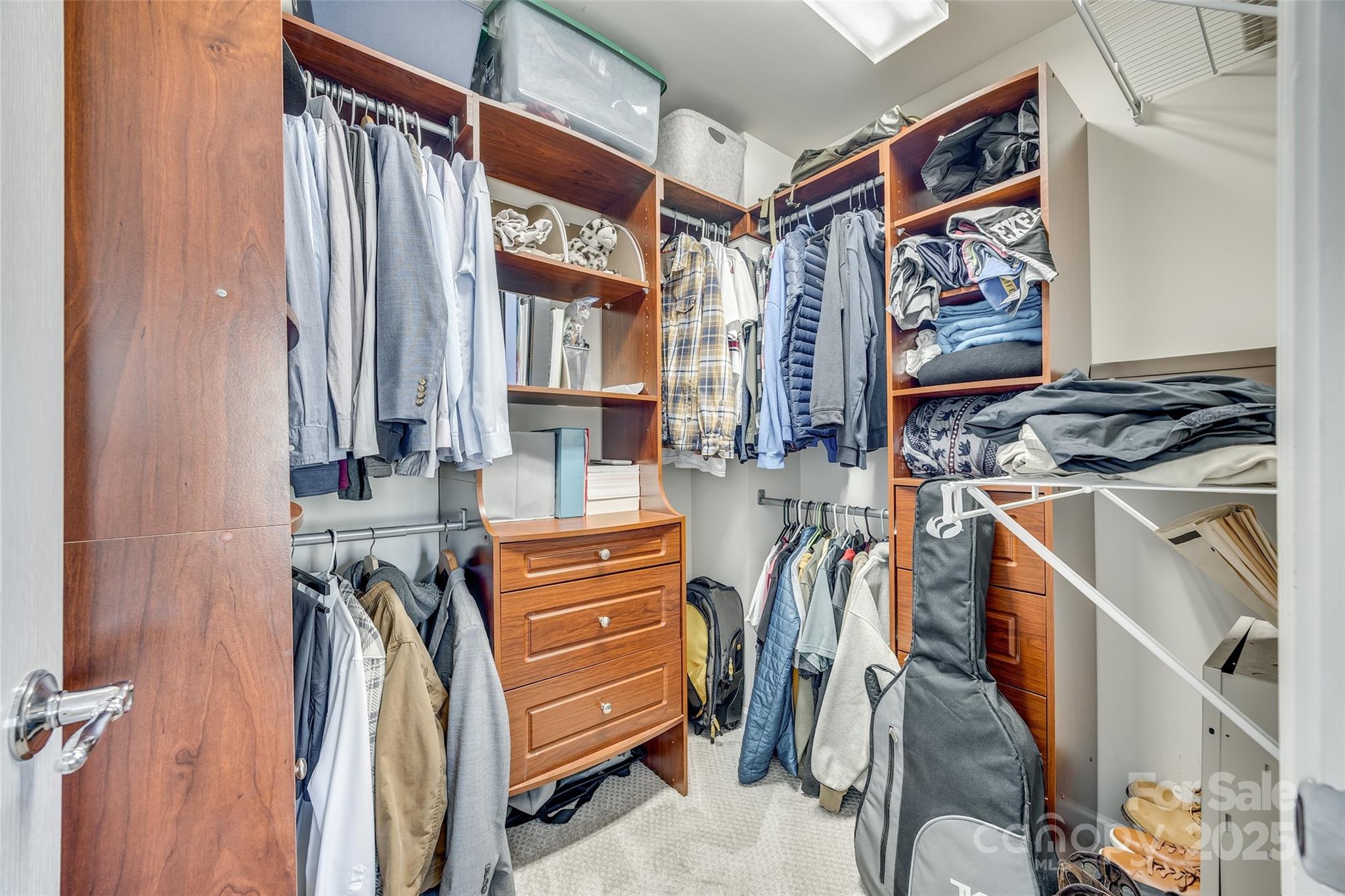 663 6th Baxter Crossing Fort Mill, SC 29708 - Photo 26 of 38 a view of walk in closet with clothes and shoes