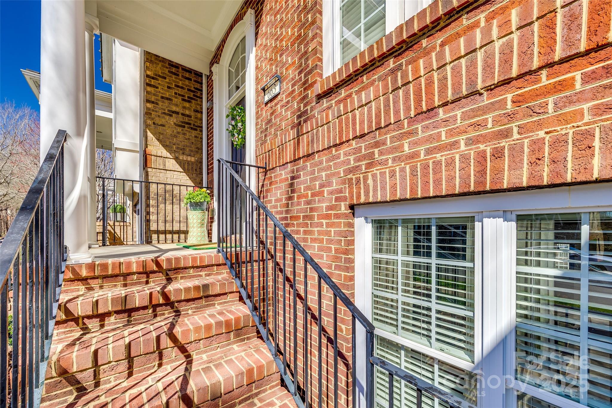 663 6th Baxter Crossing Fort Mill, SC 29708 - Photo 3 of 38 a view of a brick building with many windows