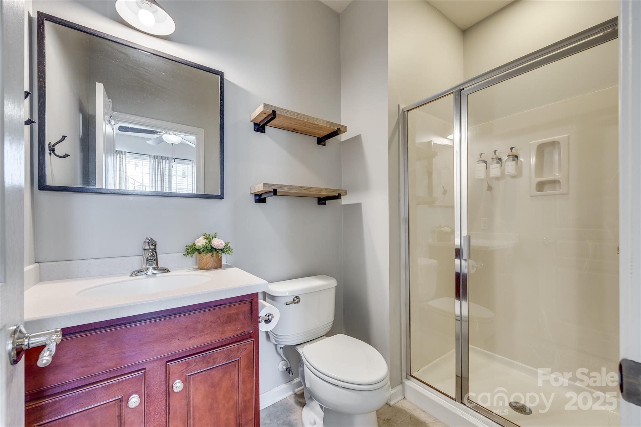 663 6th Baxter Crossing Fort Mill, SC 29708 - Photo 33 of 38 a bathroom with a sink toilet vanity and shower