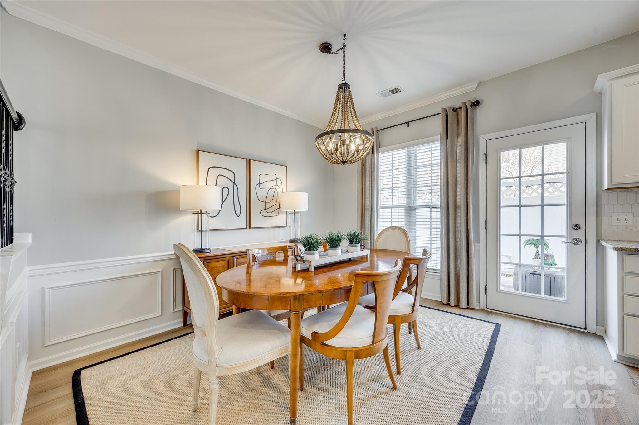 663 6th Baxter Crossing Fort Mill, SC 29708 - Photo 9 of 38 a dining room with furniture a chandelier and wooden floor