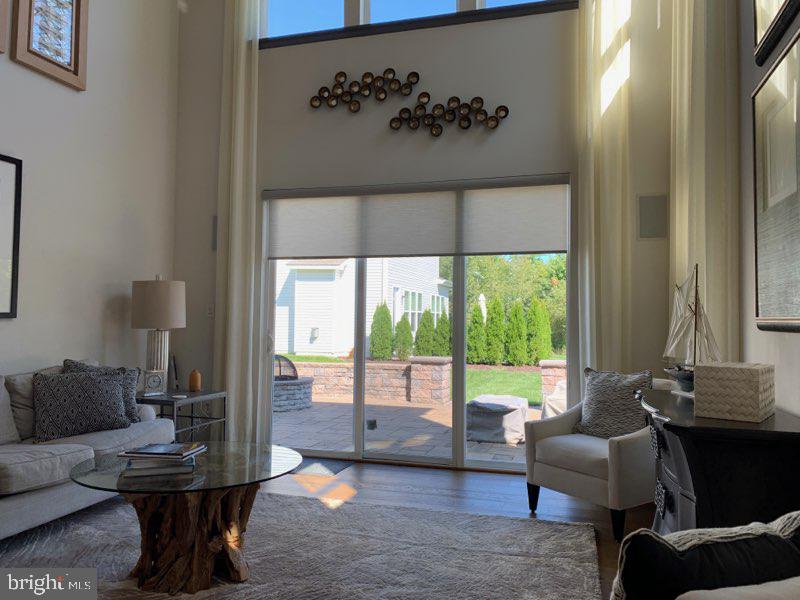 13 Basin Cove Way, Unit T82L Ocean View, DE 19970 - Photo 11 of 28 a living room with furniture and a large window