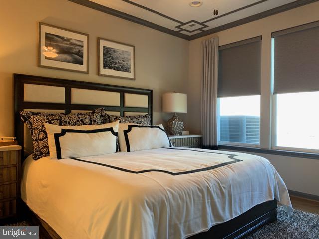 13 Basin Cove Way, Unit T82L Ocean View, DE 19970 - Photo 17 of 28 a bedroom with a bed next to a window