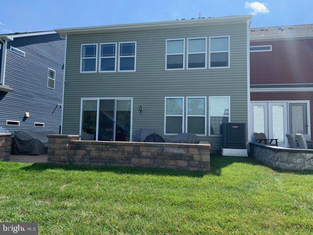 13 Basin Cove Way, Unit T82L Ocean View, DE 19970 - Photo 5 of 28 a view of house with backyard and a yard