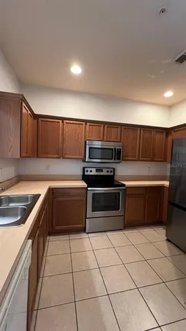 a living room with a couch and a wooden floor