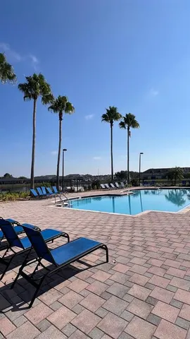 a view of street with a cars parked on the road