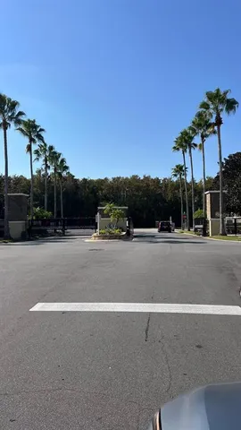an empty room with wooden floor and entryway