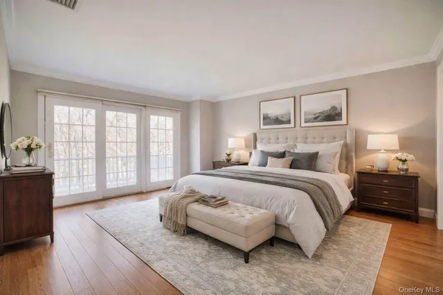 a bedroom with a large bed and a window