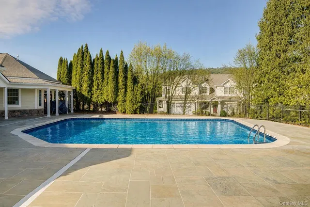 a view of outdoor space and swimming pool