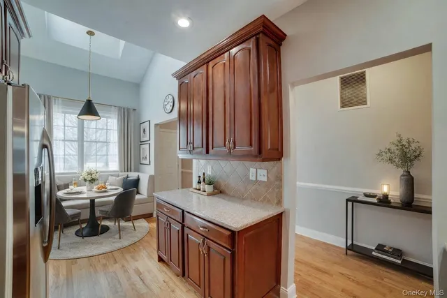 a kitchen with a sink appliances and cabinets