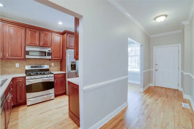 a kitchen with stainless steel appliances a stove and a refrigerator