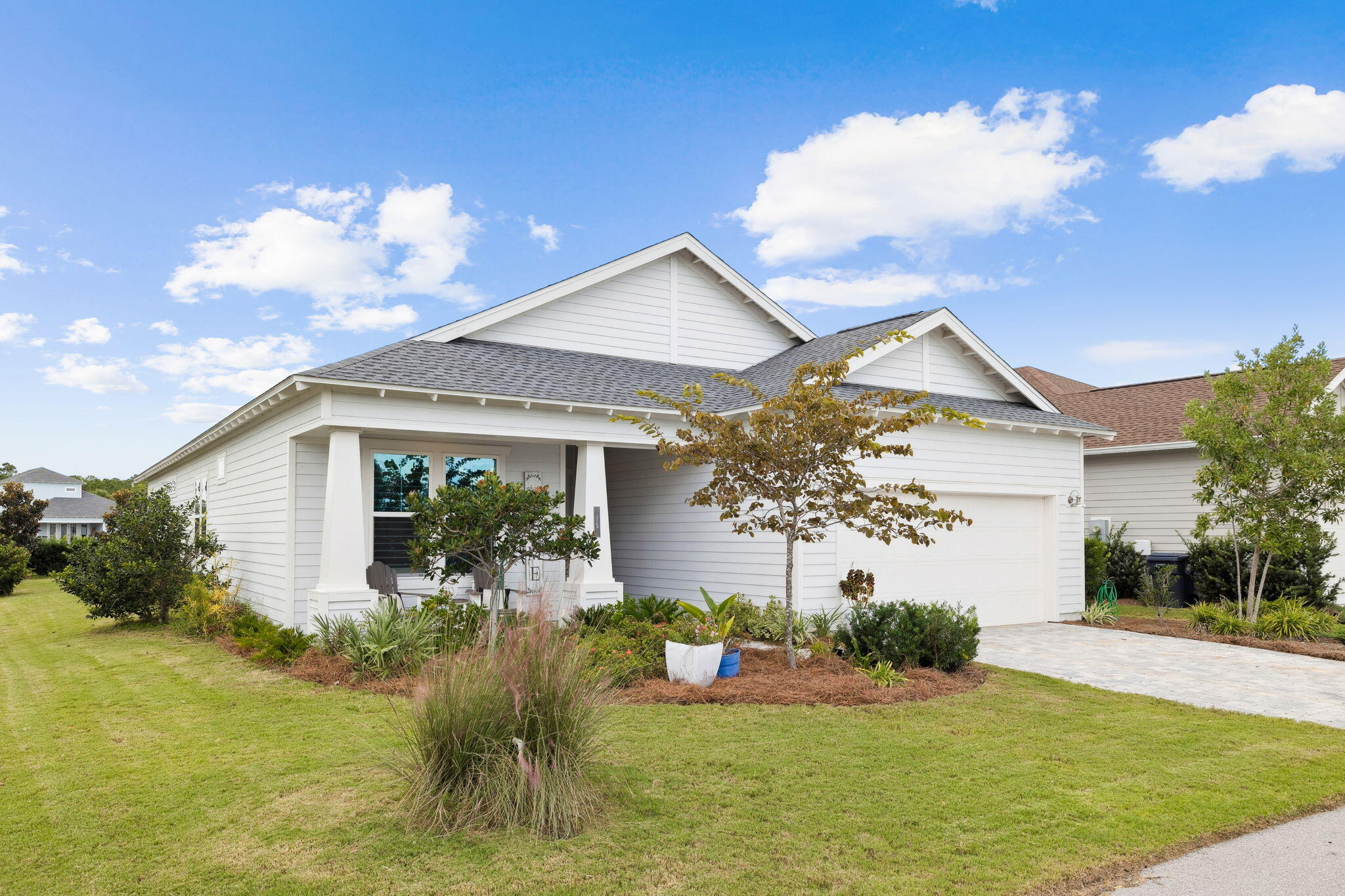 a front view of a house with garden