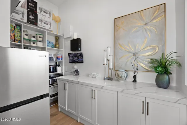 a bedroom with a large bed and a large window