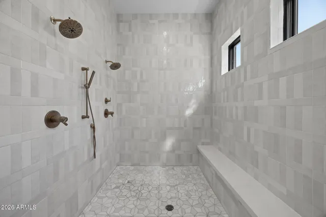 a bathroom with a granite countertop toilet a sink and a mirror