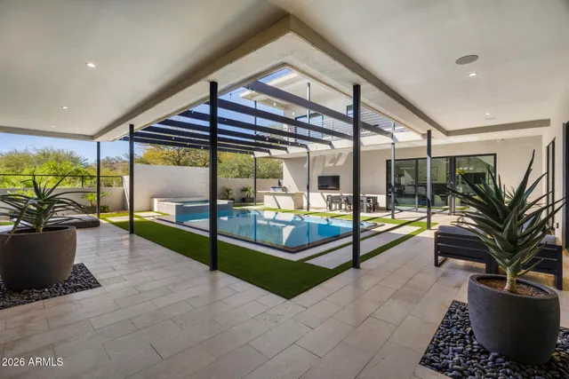an empty room with wooden floor and sliding door