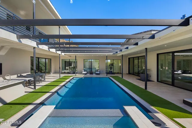 a view of a house with a snow in the background
