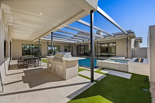 a view of a patio with chairs and a table