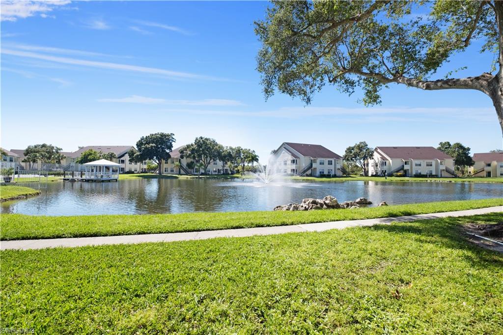 a view of a lake with houses in the back