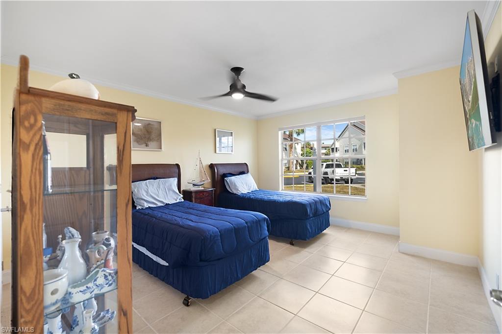 2008 Rookery Bay Drive, Unit 1102 Naples, FL 34114 - Photo 16 of 34 a living room with furniture and a window