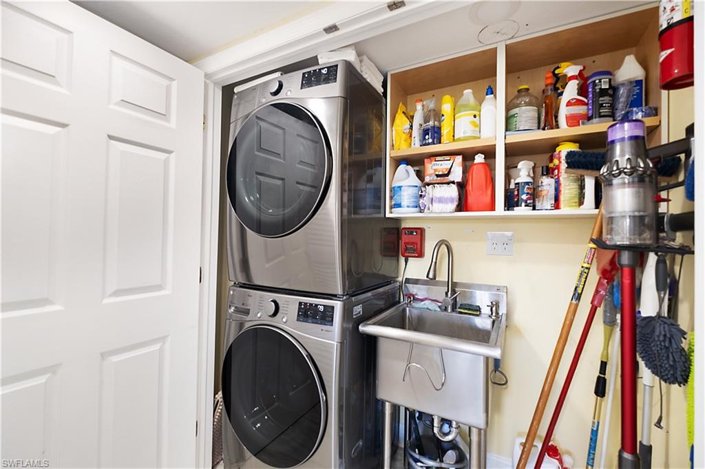 2008 Rookery Bay Drive, Unit 1102 Naples, FL 34114 - Photo 18 of 34 a utility room with dryer and washer