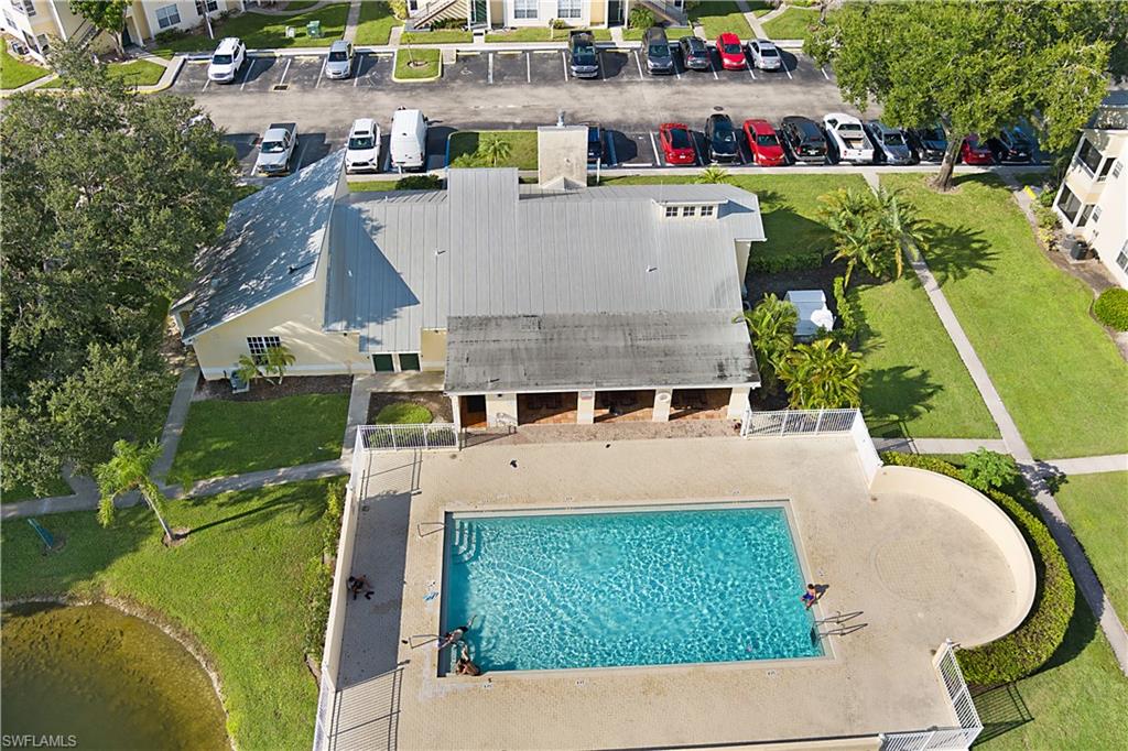 2008 Rookery Bay Drive, Unit 1102 Naples, FL 34114 - Photo 22 of 34 an aerial view of a house with swimming pool and outdoor seating