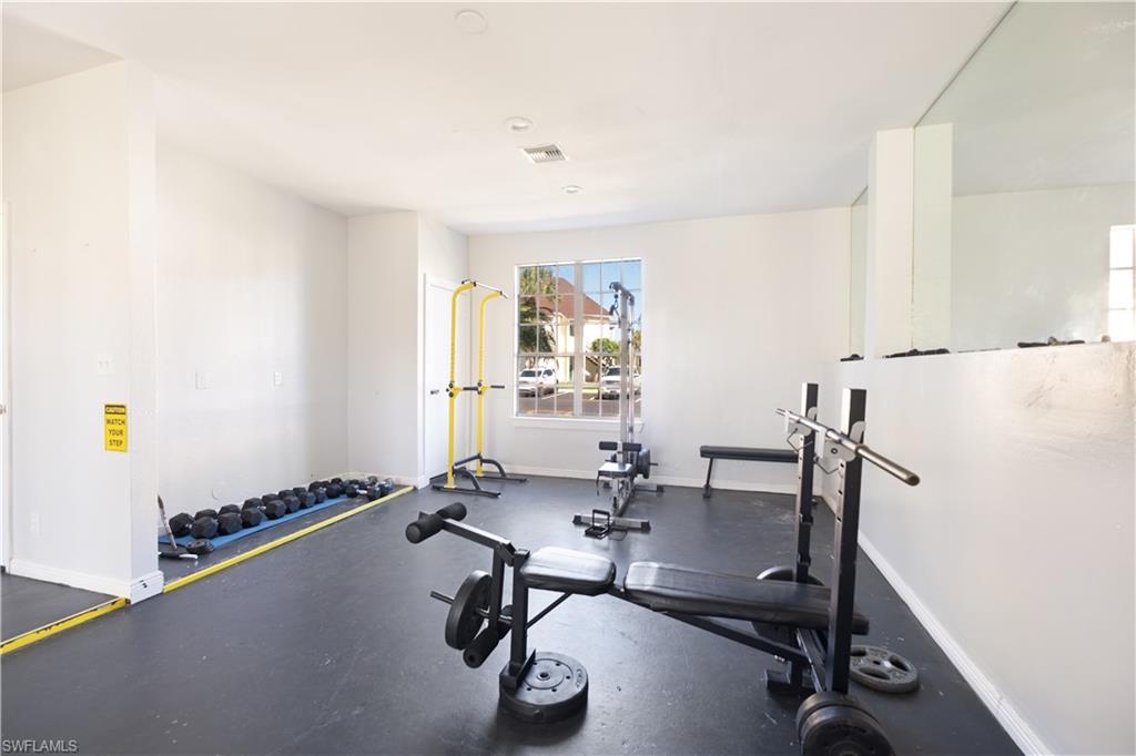 2008 Rookery Bay Drive, Unit 1102 Naples, FL 34114 - Photo 25 of 34 a view of a workspace with furniture and a window