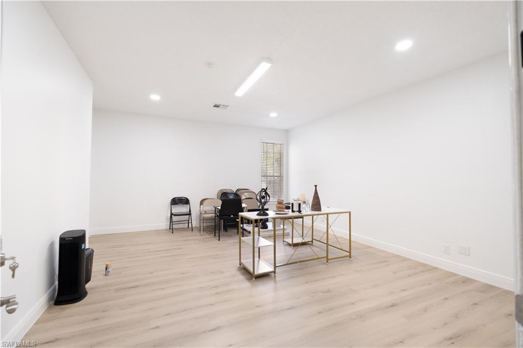 2008 Rookery Bay Drive, Unit 1102 Naples, FL 34114 - Photo 26 of 34 a dining room with furniture and wooden floor