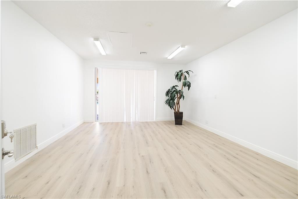 2008 Rookery Bay Drive, Unit 1102 Naples, FL 34114 - Photo 27 of 34 a view of a livingroom with wooden floor