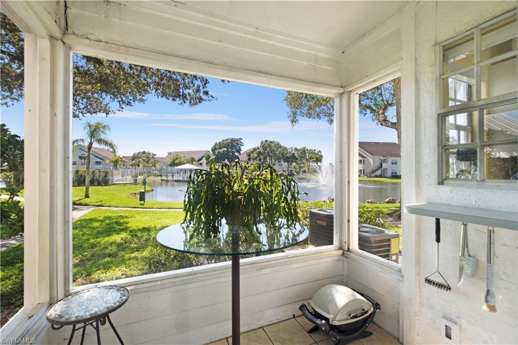 2008 Rookery Bay Drive, Unit 1102 Naples, FL 34114 - Photo 6 of 34 a view of a porch with furniture and garden