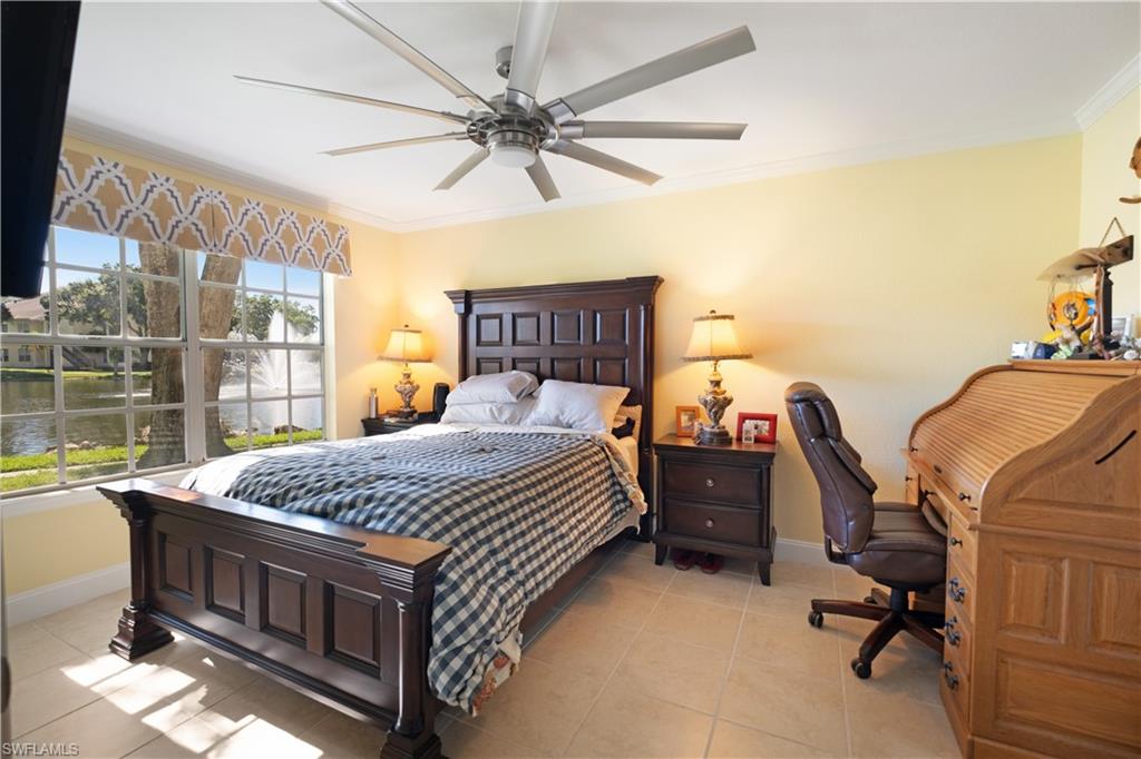 2008 Rookery Bay Drive, Unit 1102 Naples, FL 34114 - Photo 8 of 34 a bed room with a bed and a window