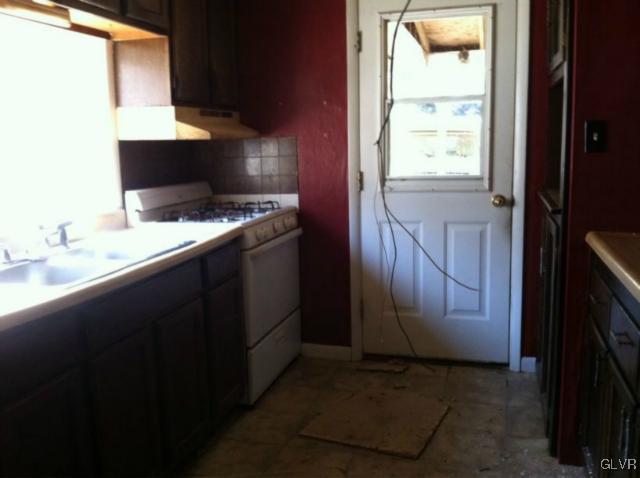 3074 South Oaks Road Bath, PA 18014 - Photo 11 of 12 a kitchen with a refrigerator and a stove