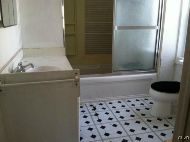 3074 South Oaks Road Bath, PA 18014 - Photo 4 of 12 a bathroom with a sink and a toilet