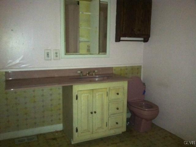 3074 South Oaks Road Bath, PA 18014 - Photo 8 of 12 a bathroom with a sink and a mirror