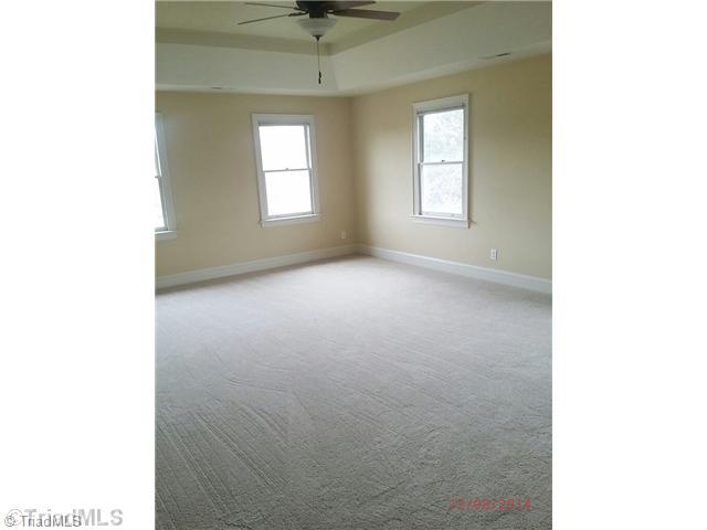 8205 Brittains Field Road Oak Ridge, NC 27310 - Photo 9 of 16 Master Bedroom.
