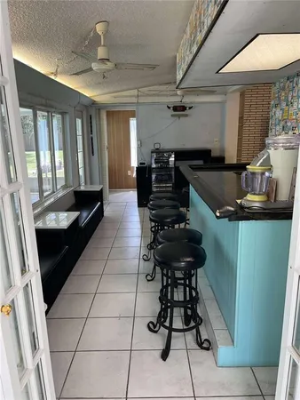 a kitchen with a table and chairs in it