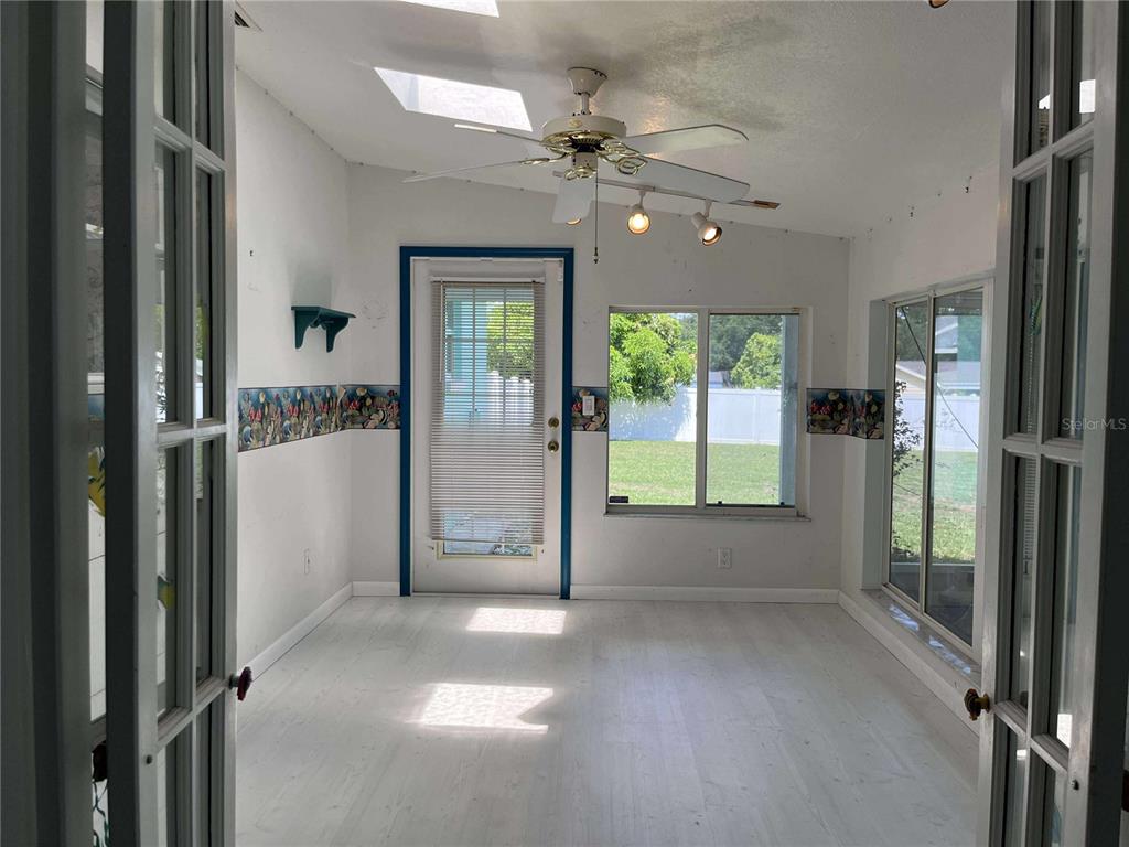 608 Knowles Road Brandon, FL 33511 - Photo 17 of 41 a view of a big room with windows and entryway