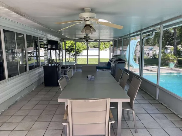 a view of a dining room with furniture window and outside view