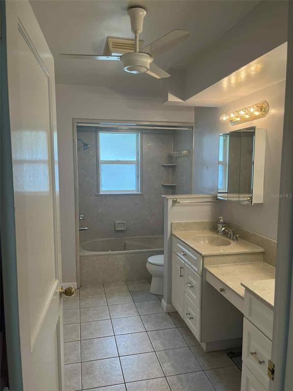 608 Knowles Road Brandon, FL 33511 - Photo 29 of 41 a spacious bathroom with a granite countertop sink a toilet and shower