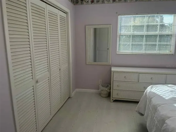 a view of a bedroom with a window
