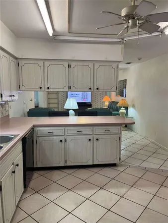 a kitchen with a sink and cabinets