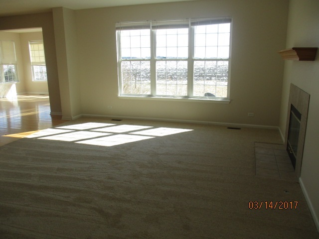 204 Wilkins Road Sycamore, IL 60178 - Photo 14 of 24 a view of an empty room with a window