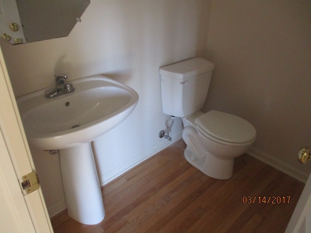204 Wilkins Road Sycamore, IL 60178 - Photo 15 of 24 a white toilet sitting next to a sink
