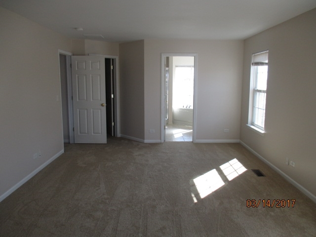204 Wilkins Road Sycamore, IL 60178 - Photo 16 of 24 an empty room with windows