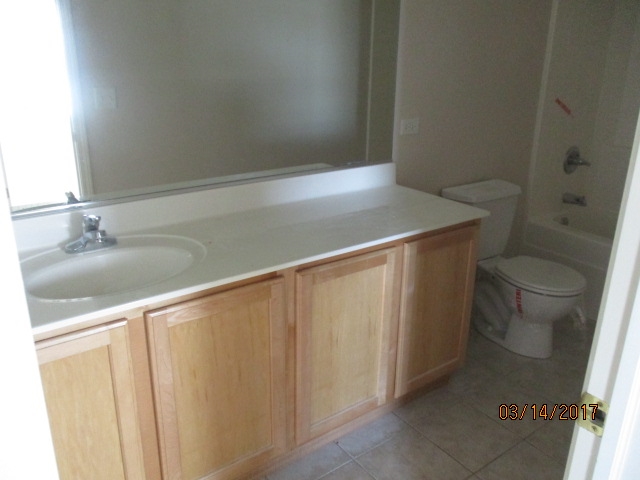 204 Wilkins Road Sycamore, IL 60178 - Photo 23 of 24 a bathroom with a sink and a toilet