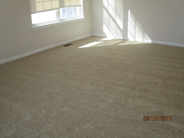 204 Wilkins Road Sycamore, IL 60178 - Photo 24 of 24 a view of a livingroom with an empty space and a window