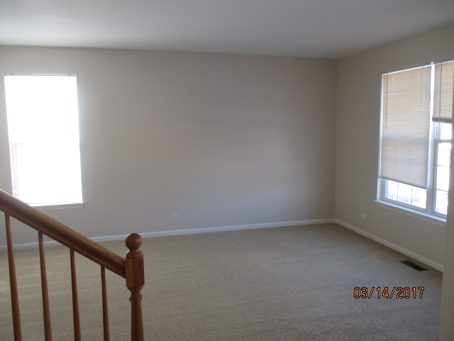 204 Wilkins Road Sycamore, IL 60178 - Photo 3 of 24 a view of empty room with window